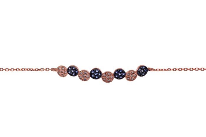 Rose gold bracelet with blue and white diamonds.